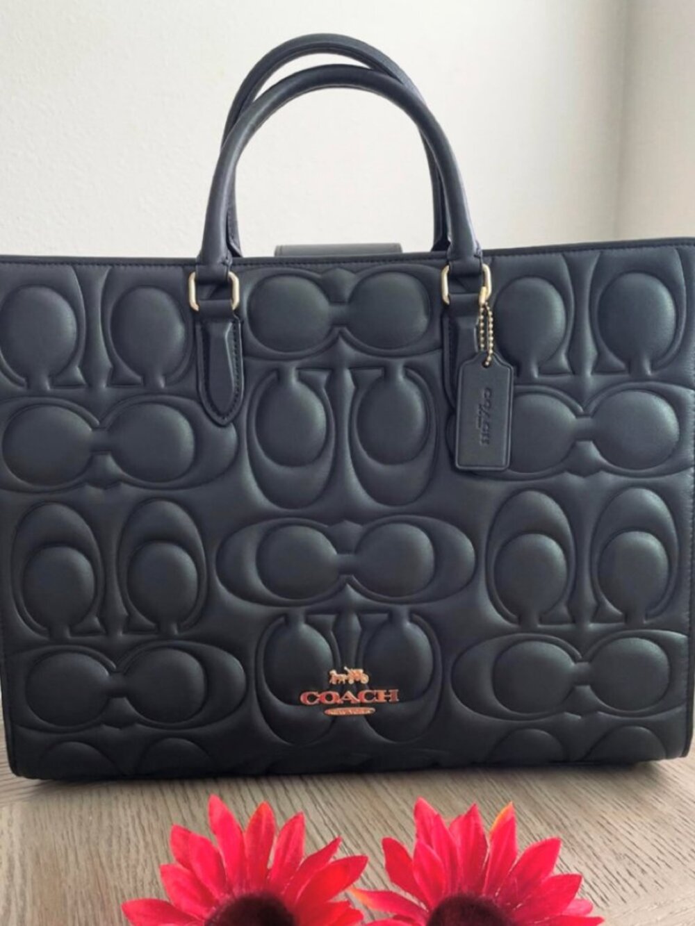 COACH black embossed C-shaped double handle tote bag
